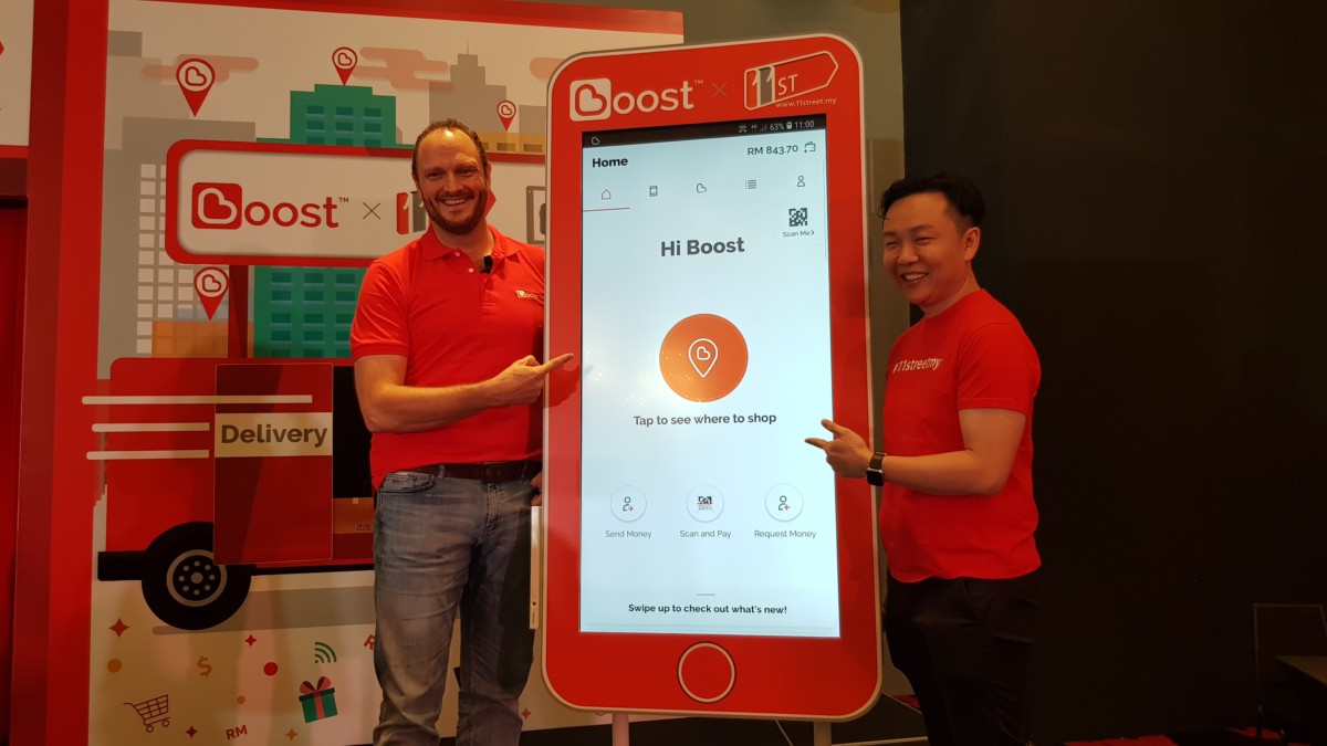 Christopher Tiffin, CEO of Boost and Cheong Chia Chou, CEO of 11street at the launch event